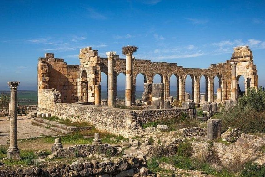 Ancient ruins with columns and arches. 4