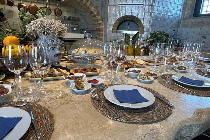 A table set for a meal with plates, cutlery, and wine glasses. 4
