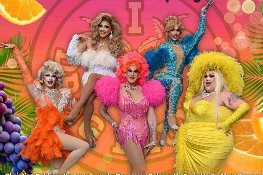 A group of people in colorful costumes with a tropical background. 4