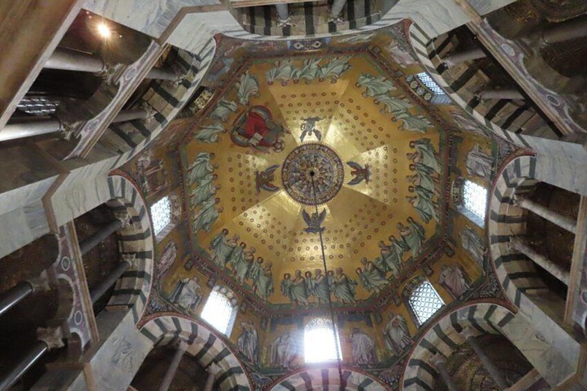 A domed ceiling with intricate mosaics and architectural details. 5
