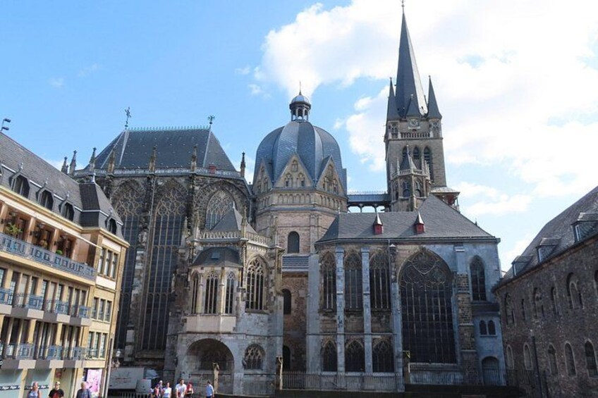 A historic cathedral with a large dome and a tall spire. 1