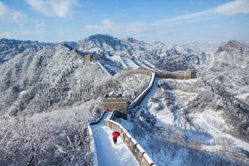 The Great Wall of China in a snowy landscape. 4