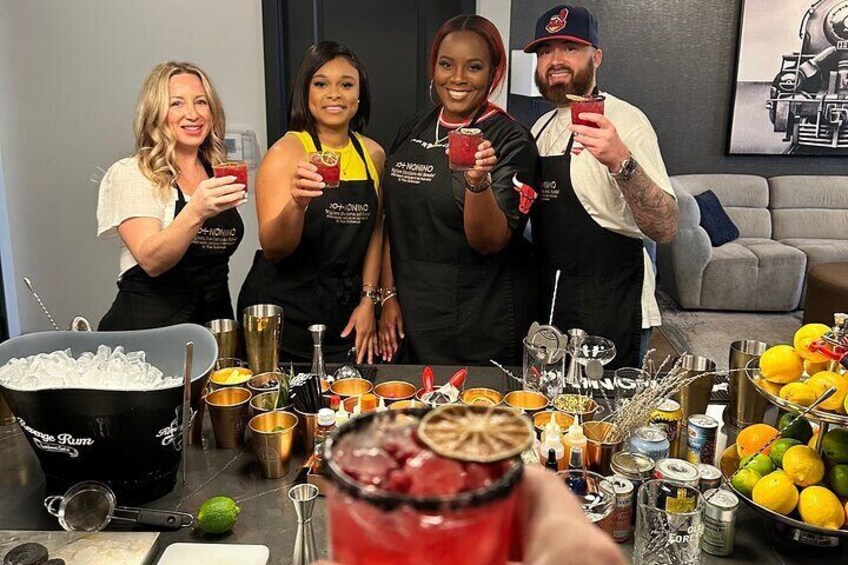A group of people at a bar with various drinks and ingredients. 5