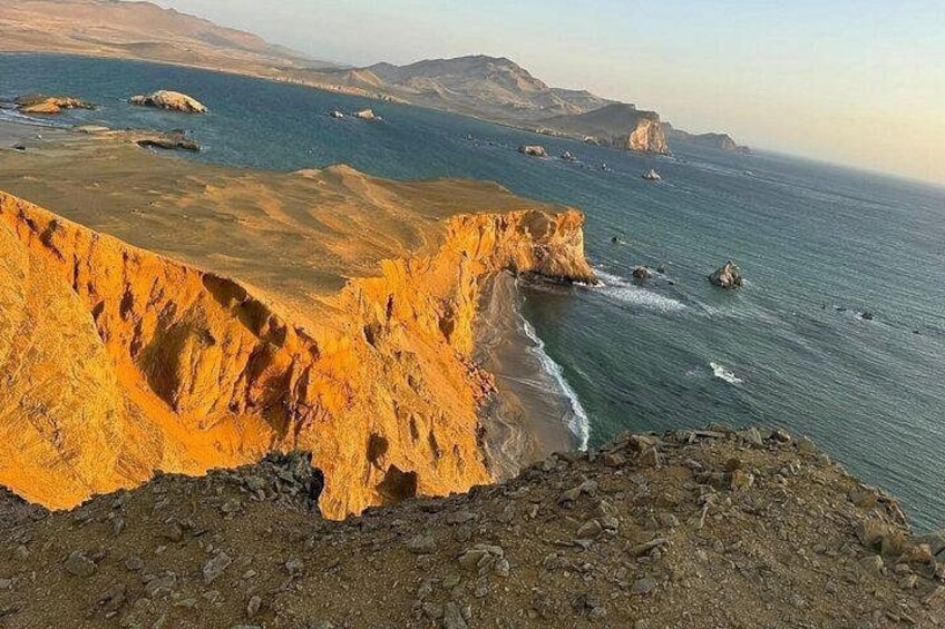 A coastal landscape with cliffs and the ocean. 1