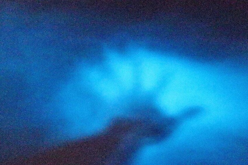 A night sky with a visible blue light source. 2