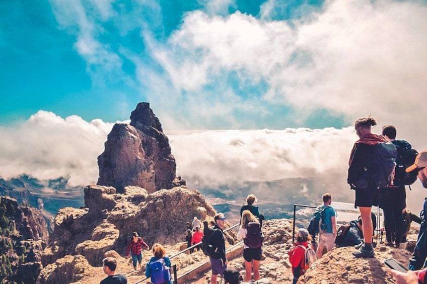 A rocky mountain landscape with hikers. 2
