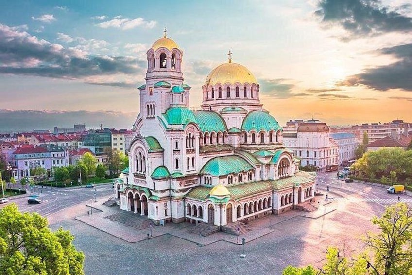 A large, ornate church with multiple domes and a prominent bell tower. 1