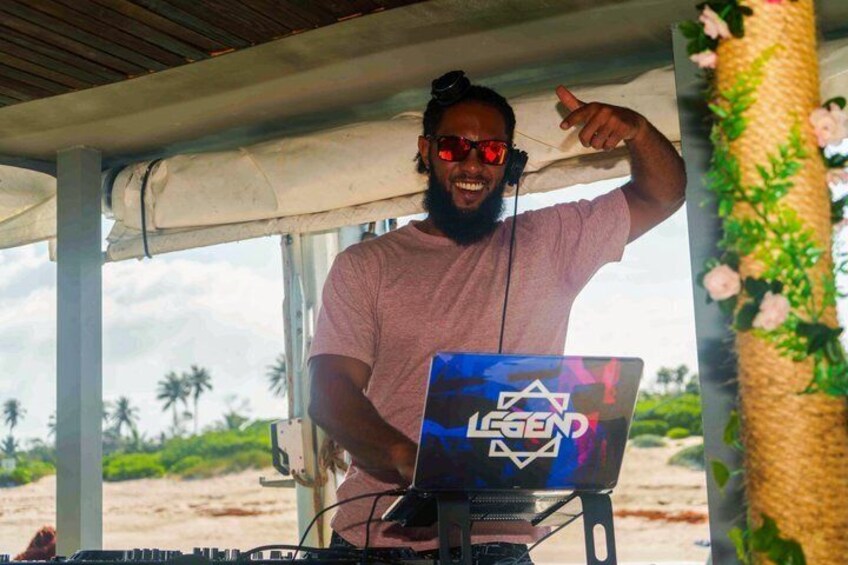 A person with a laptop labeled 'LEGEND' on a beach. 2