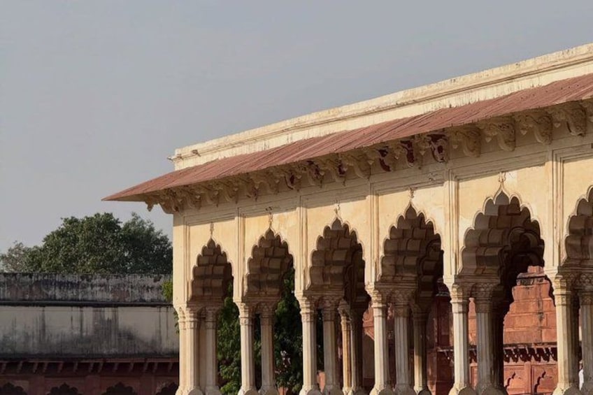 A historical building with arched windows and columns. 2