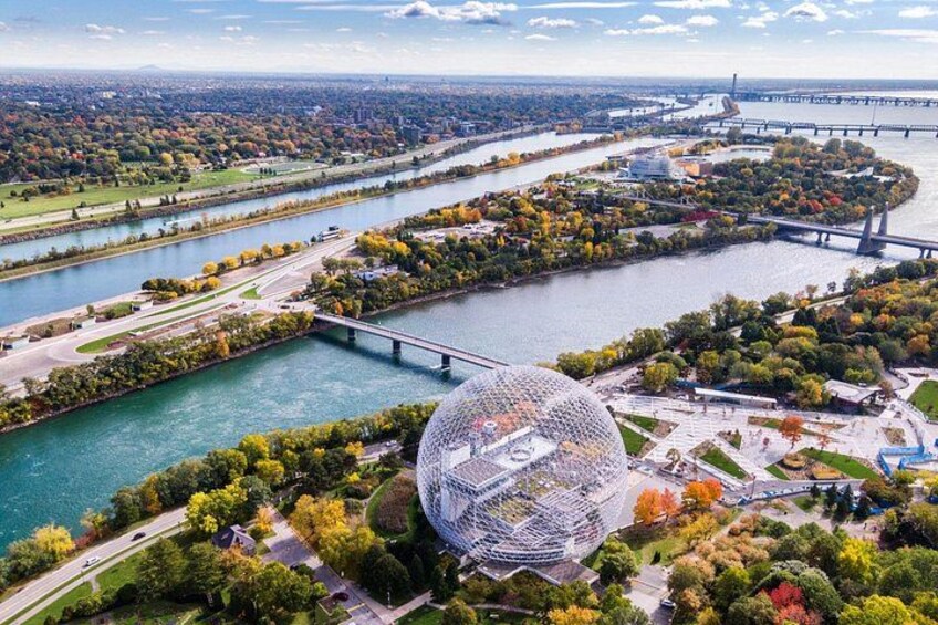 A river, a bridge, a spherical structure, and a park. 2