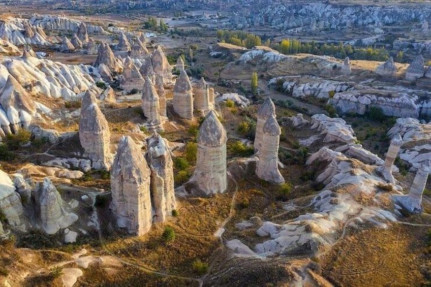 A landscape with numerous tall, slender rock formations. 4