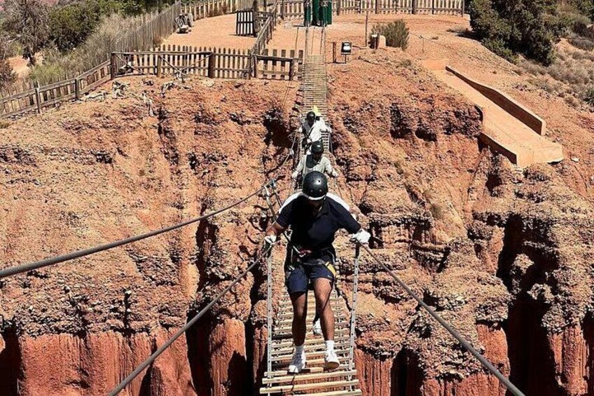 Breathtaking Atlas Mountain backdrop as adventurers prepare for zipline launch near Marrakech. All equipment provided; just bring your sense of adventure 2