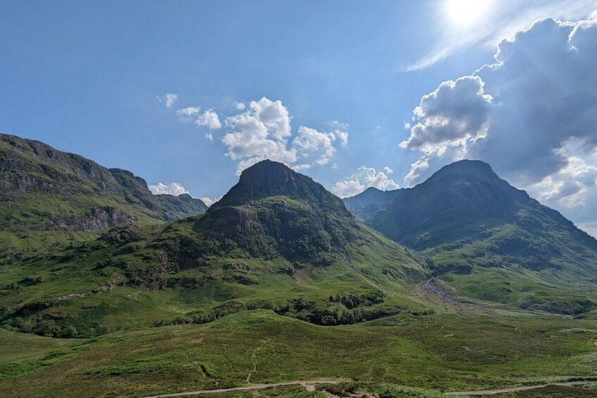 A mountainous landscape with a prominent peak and rolling hills. 5
