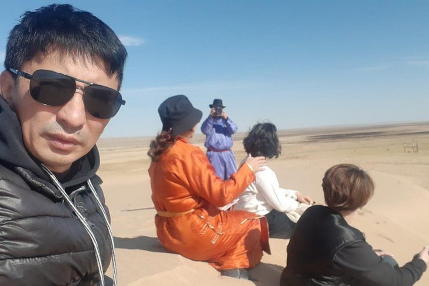 A group of people in a desert landscape. 5