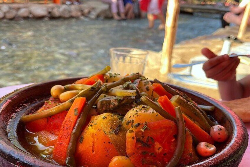 A stew with carrots, potatoes, and green beans in a clay pot. 3