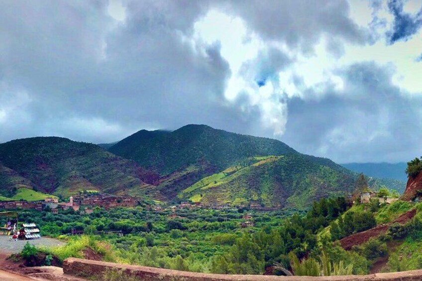 A mountainous landscape with a village nestled in the valley. 5