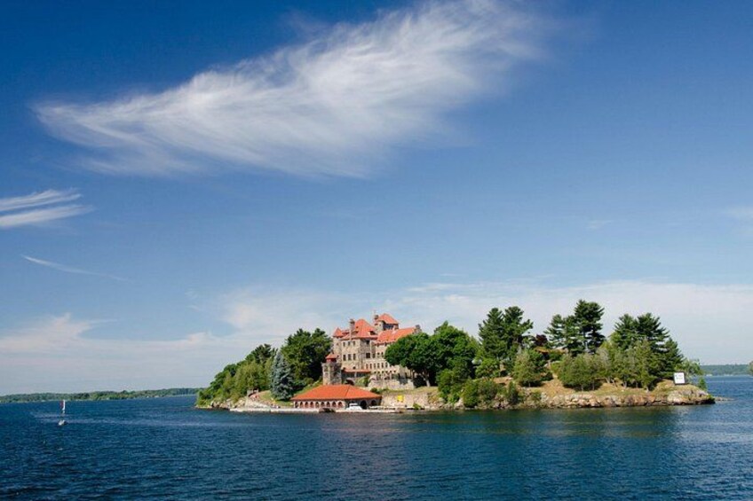 A large island with a castle-like structure surrounded by water. 4