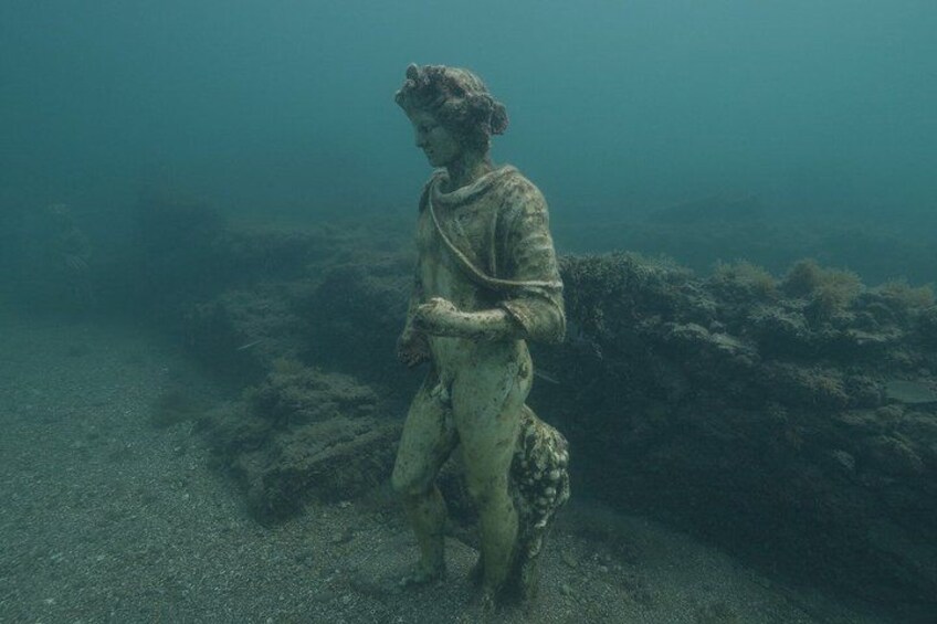 A submerged statue in clear water. 2