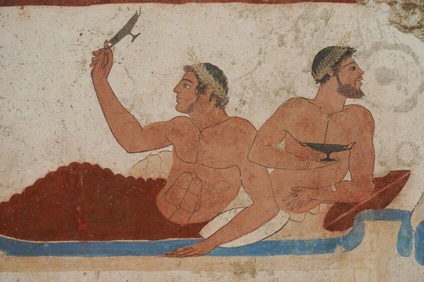 Une fresque représentant deux personnages assis sur un bateau et tenant des objets. 2