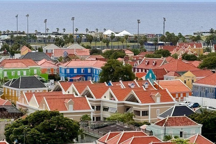 A coastal town with colorful houses and a view of the sea. 5