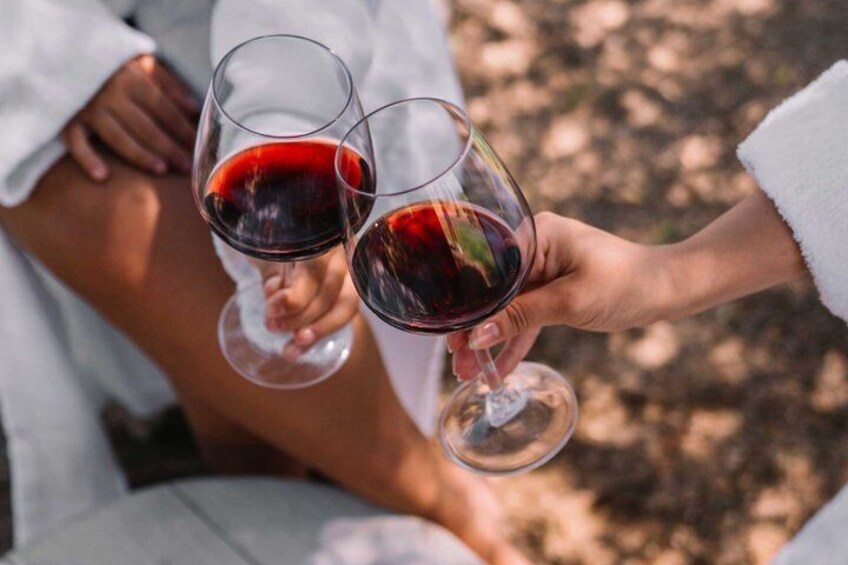 Two people holding wine glasses. 2