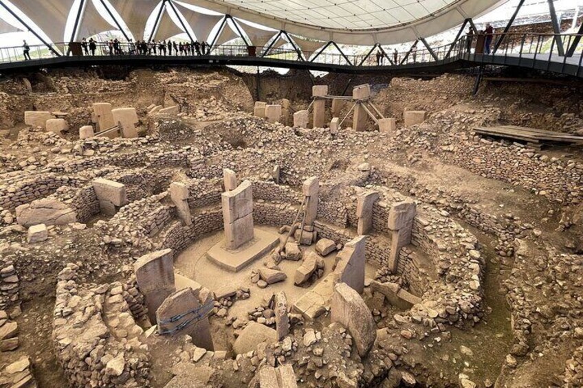 An archaeological site with stone structures and ruins. 1