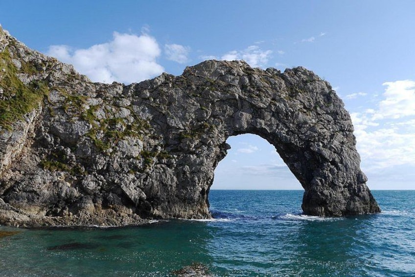 A natural rock arch formation in a body of water. 1