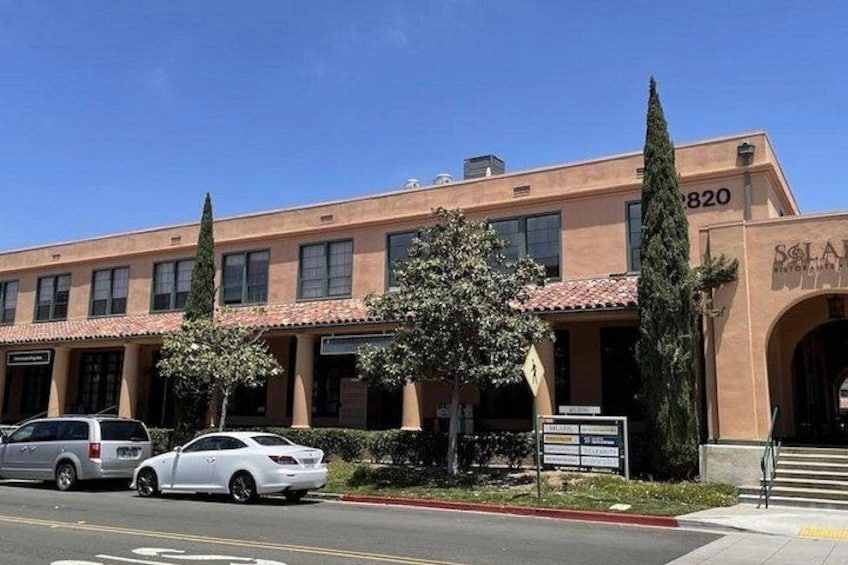 A building with a sign reading 'SOLAR' and the number '2820' on the facade. 4