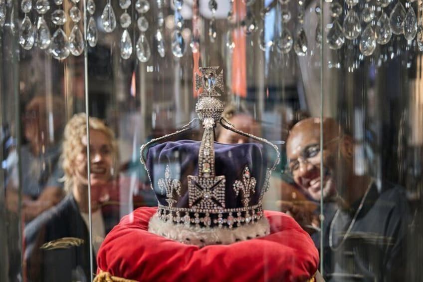 A jeweled crown on a red cushion. 4