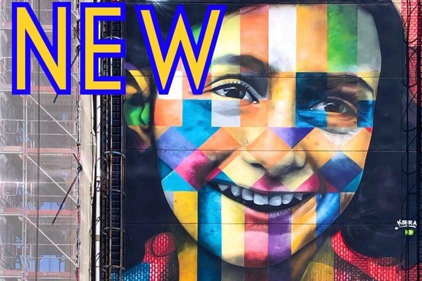A colorful mural with the word 'NEW' prominently displayed. 2