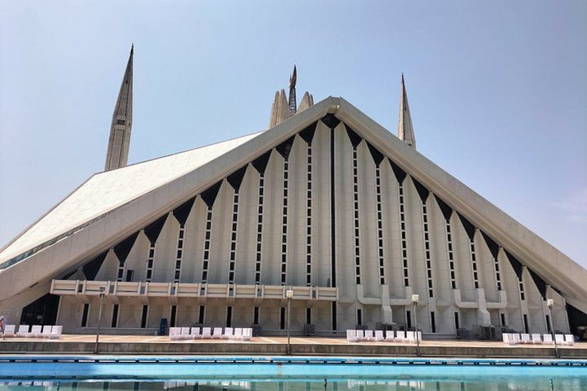A modern building with a triangular roof and spires. 2