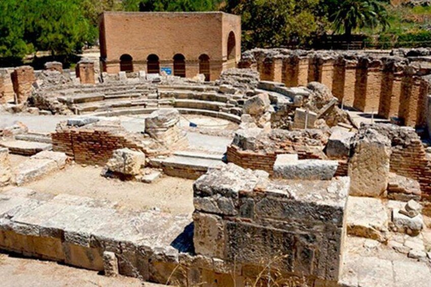 Ancient ruins with brick structures and scattered stone blocks. 4
