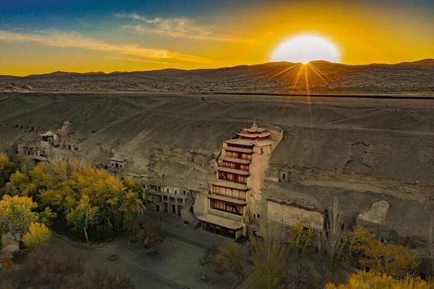 A traditional building with a tiered roof structure, surrounded by sparse vegetation and a vast, open landscape. 2