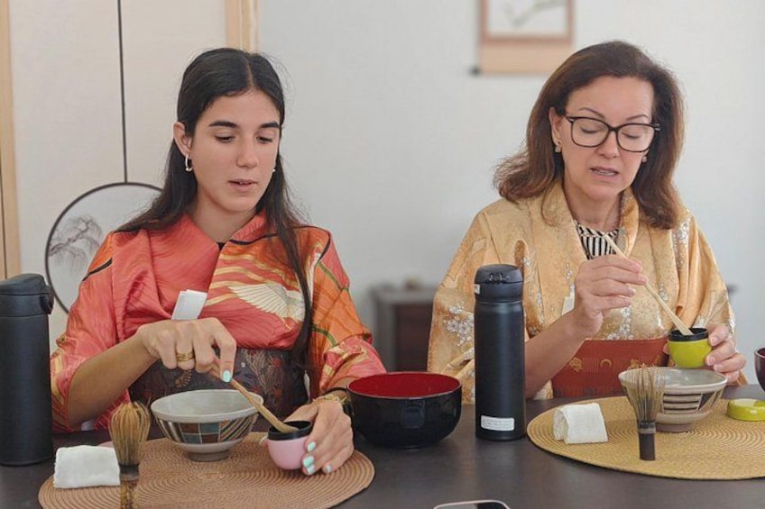 Guests enjoying the tea ceremony in colorful kimono 5