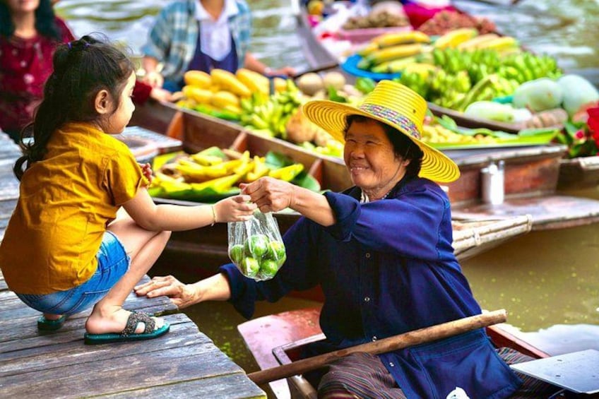A person in a boat, a child, and a market with various fruits. 4