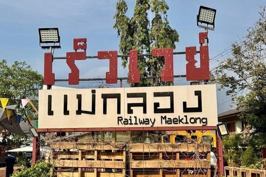 A sign with text in multiple languages, including English, and a structure with a solar panel. 5
