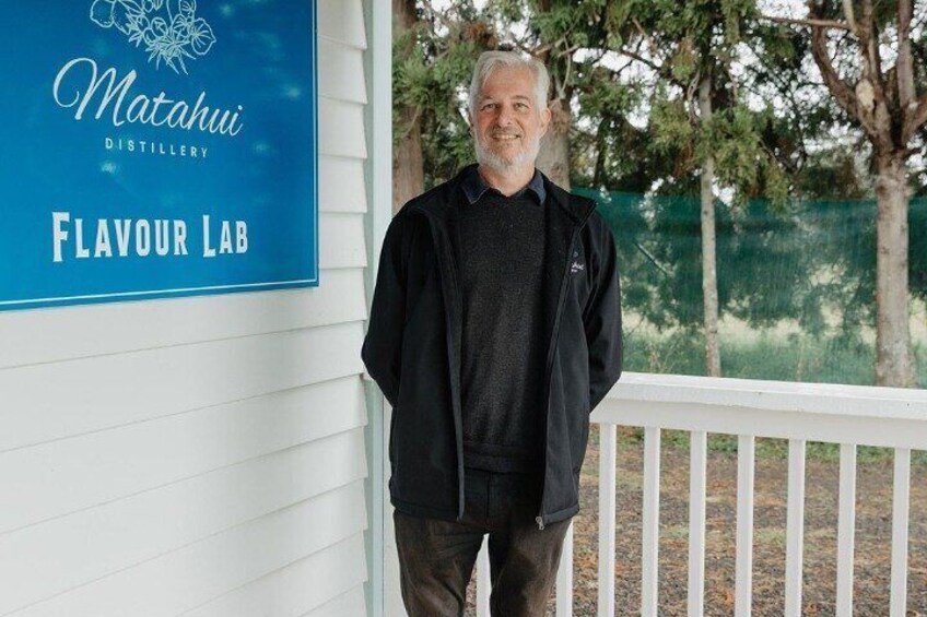 A man standing in front of a sign that reads "Matahui Distillery Flavour Lab." 2