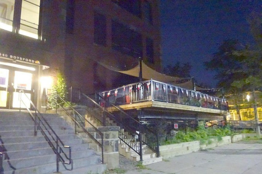 A building with a balcony, steps, and a sign that reads 'BOSFORD.' 4