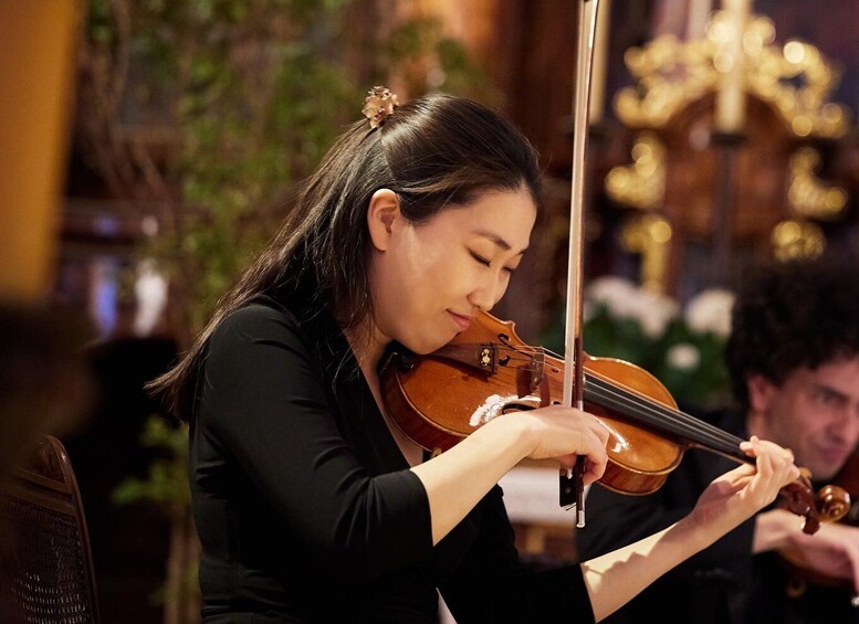 A person playing a violin. 1