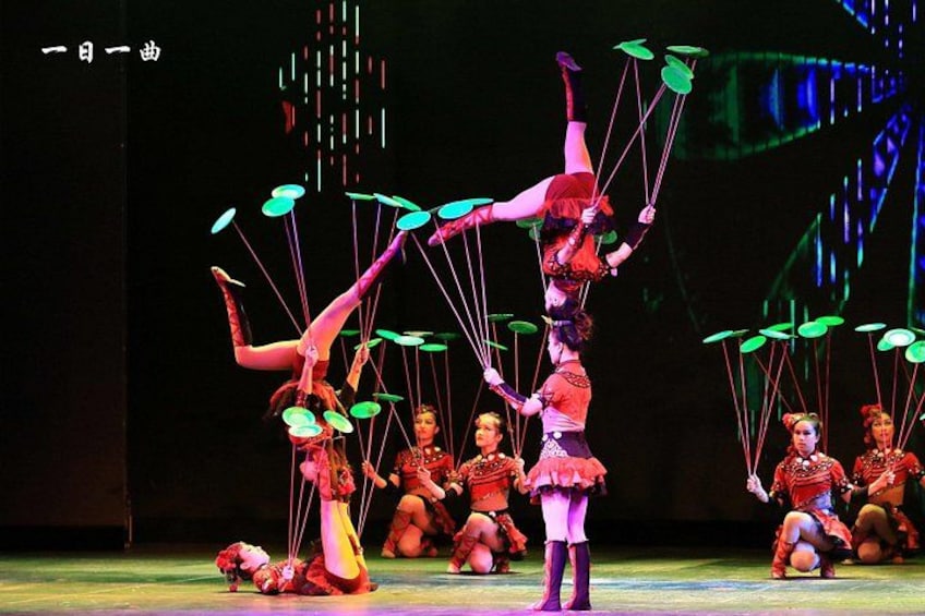A circus performance with acrobats and clowns. 1