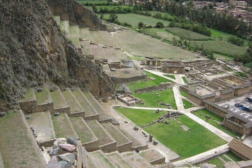 An ancient archaeological site with terraced structures and ruins. 1