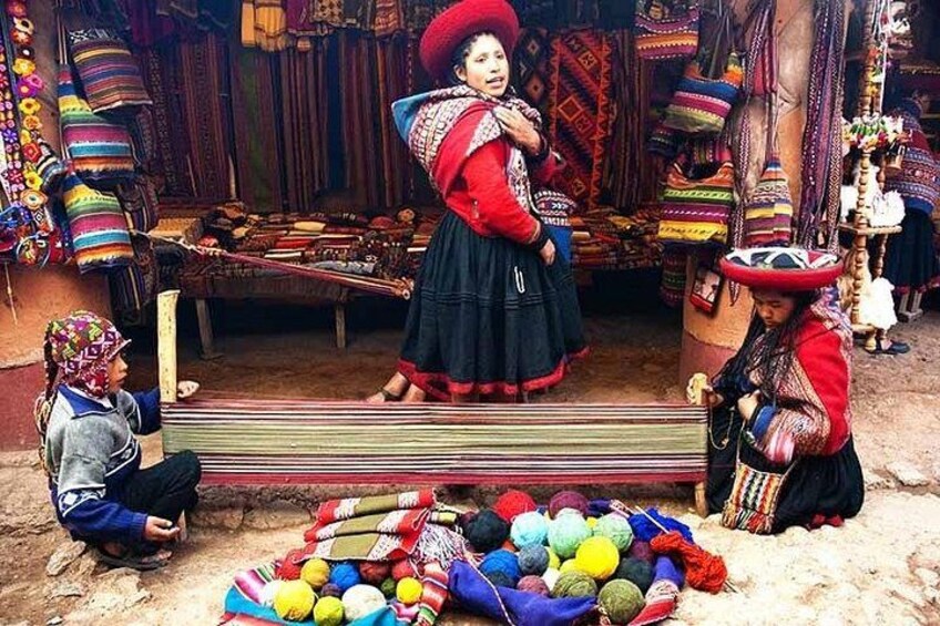 A market scene with colorful textiles and traditional attire. 2