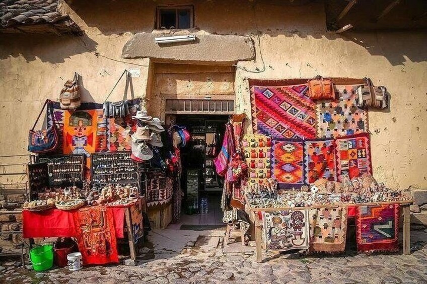 A traditional market stall with colorful textiles and pottery. 5
