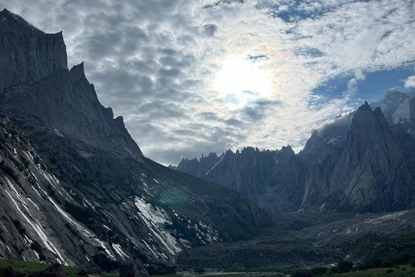A mountainous landscape with rugged peaks and a valley. 2