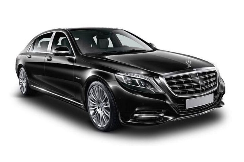 A black luxury sedan with a prominent grille, chrome detailing, and alloy wheels. 4