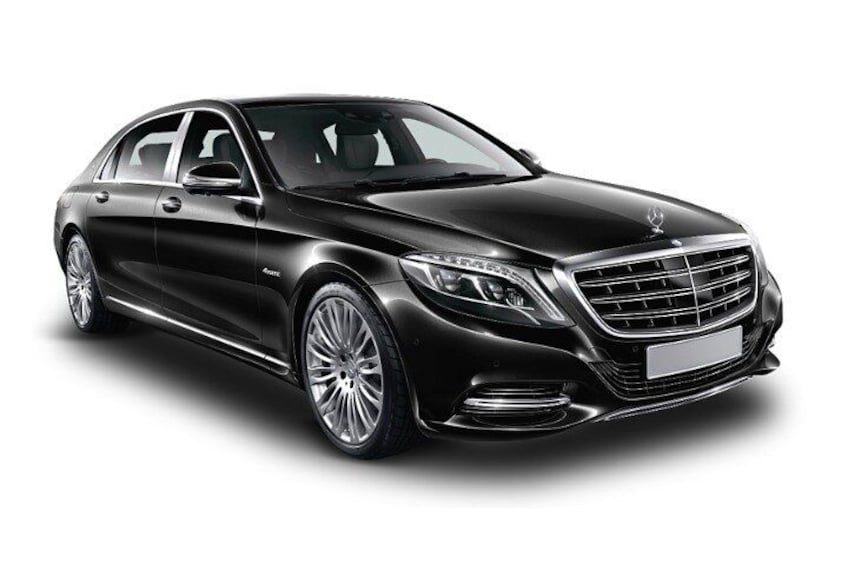 A black luxury sedan with a prominent grille, alloy wheels, and a sleek design. 2