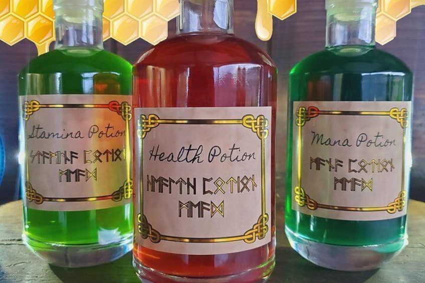 Three bottles of liquid with labels. 4