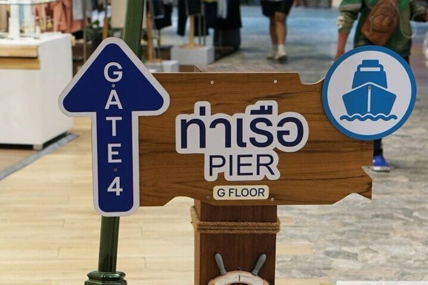 A sign for Gate 4 and Pier G on the G Floor. 3