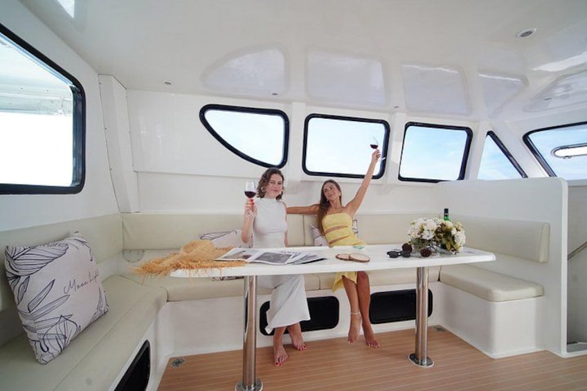 A woman holding a wine glass on a yacht. 5