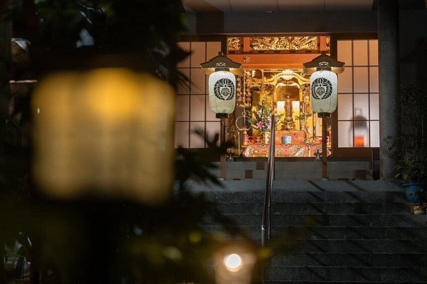 A shrine with traditional Japanese architecture, including a torii gate and lanterns. 3